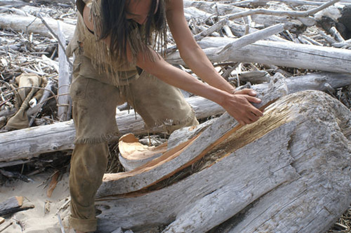 traditional kayak building with driftwood