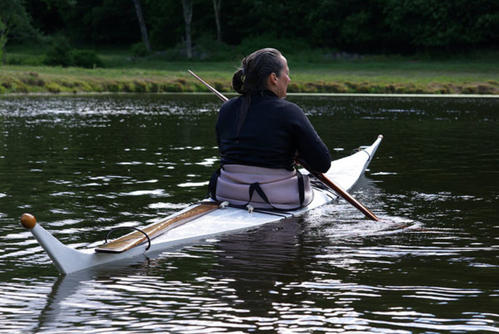 paddling a skin-on-frame kayak