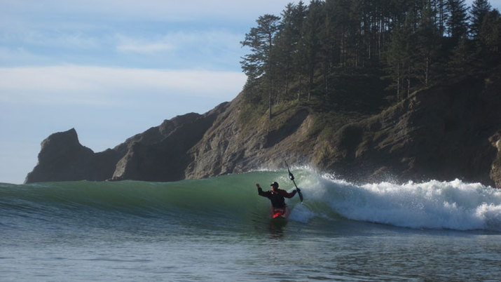 surfing a kayak at cape falcon oregon