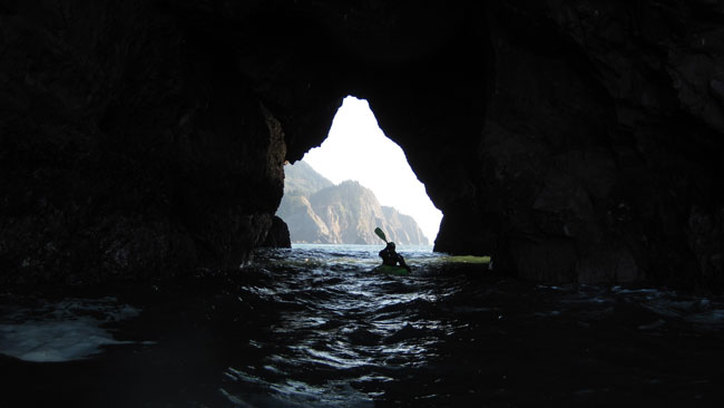 Kayak in sea cave, Oregon coast